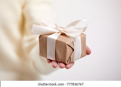 Hands Holding Craft Gift Box