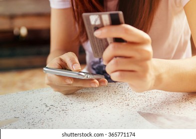 Hands Holding Credit Card And Using Mobile Smart Phone With Morning, Online Shopping.