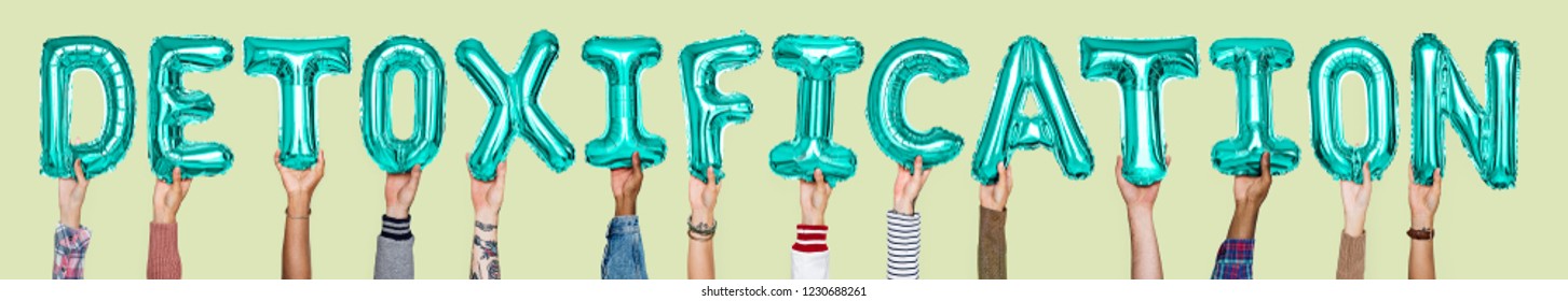 Hands holding detoxification word in balloon letters
