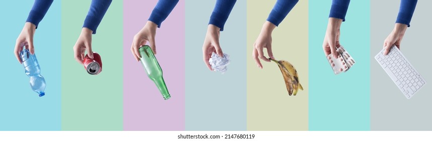 Hands holding different kinds of waste and materials, separate waste collection and recycling concept - Shutterstock ID 2147680119