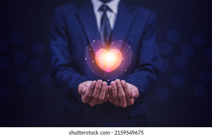 hands holding digital heart on visual screen , health care, love, organ donation,world heart day, world health day,