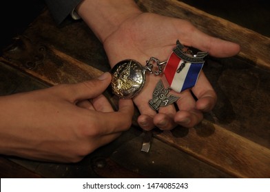 Hands Holding An Eagle Scout  Medal.