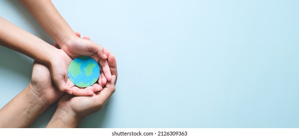 Hands holding earth, save planet, earth day, ecology environment, climate emergency action, csr social responsibility, sustainable living concept