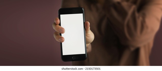 Hands Holding Empty Design Space Screen Monitor Mobile Phone. Hands hold mobile phone in hands close up front view. Mockup of mobile phone banner use for presentation Application design
