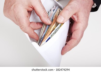 Hands Holding Envelope With Cash