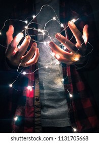 Hands Holding Fairy Lights