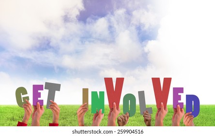 Hands holding up get involved against green field - Shutterstock ID 259904516