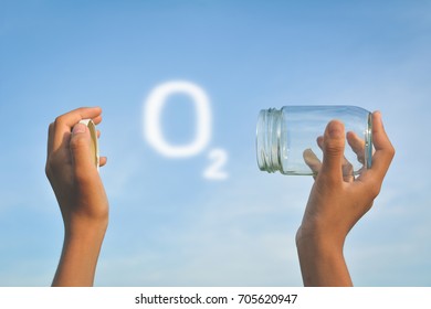 Hands Holding Glass Jar For Keeping Fresh Air Concept Of Environment And Save Clean Ozone
