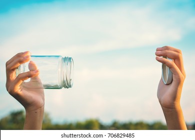 Hands Holding Glass Jar For Keeping Fresh Air Concept Of Environment And Save Clean Ozone
