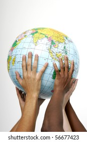 Hands Holding Up A Globe, On White Background