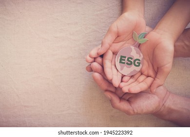 Hands Holding Growing Tree On Earth, ESG Environmental, Social And Corporate Governance Concept