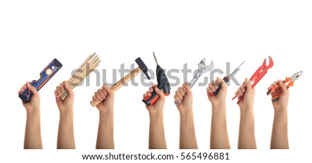 Hands holding hand tools isolated on white background