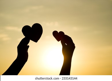 Hands Holding Hearts Silhouette Stock Photo (Edit Now) 233143144