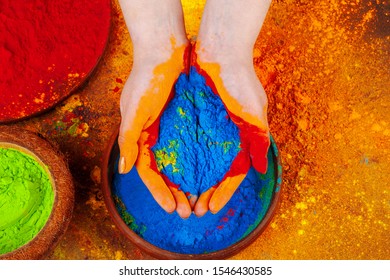 Hands Holding Holi Powder Paint, View From Above