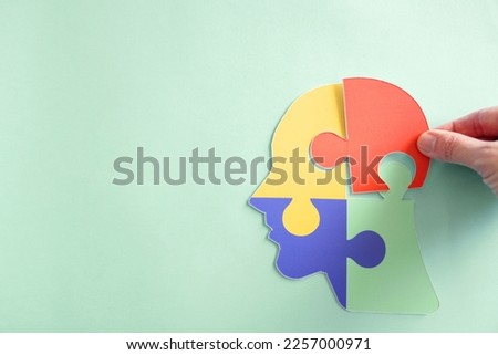 Hands holding jigsaw puzzle head shape, Autism awareness, Autism spectrum disorder (ASD), World Autism Awareness Day