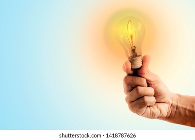 
Hands holding a light bulb and having light - Shutterstock ID 1418787626