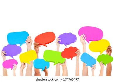 Hands holding multi colored speech bubbles. - Shutterstock ID 174765497