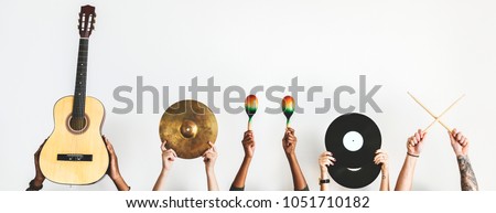 Hands holding music instruments