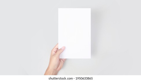 Hands Holding Paper Blank For A Letter Paper