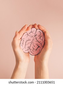 Hands Holding Paper Brain.
Mental Health Disorder Concept. World Health Day. Global Health Awareness Concept.   Montessori Education