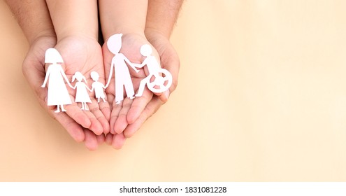 hands holding paper Cutout of different family members being together. - Shutterstock ID 1831081228