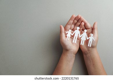 Hands Holding Paper Family Cutout, Life Health Insurance, Social Distancing Concept, Covid19,  On The Grey Color Background, Family Protection                             