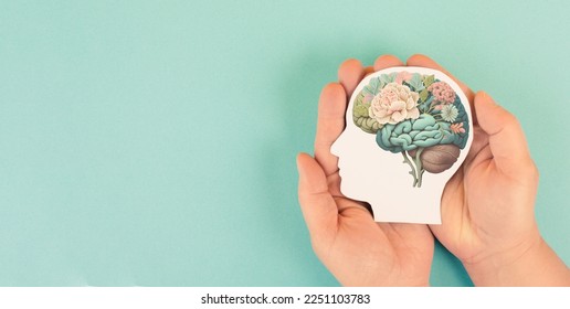 Hands holding paper head, human brain with flowers, self care and mental health concept, positive thinking - Shutterstock ID 2251103783
