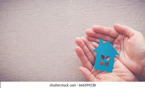 hands holding paper house, homeless housing shelter and real estate , family house insurance, social distancing, homeschool concept