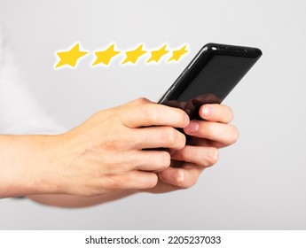 Hands Holding Phone For Giving Five Star Feedback. Satisfaction Survey. Positive Customer Experience. Service, Hotel, Application, Restaurant Evaluation. High Quality Photo