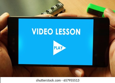 Hands Holding Phone With Video Lesson. Online Education Concept.