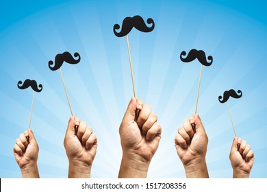 Hands holding Photo booth props, Black Mustache and rising them up