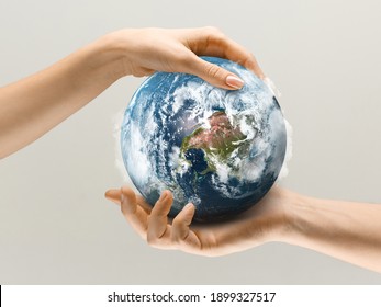 Hands Holding Planet Earth, Close Up. Environment Save, Taking Care Of Nature And Ecology, Supporting Hands Concept. Globe Woldwide Protection, Traveling And Protecting Of Human's Home.