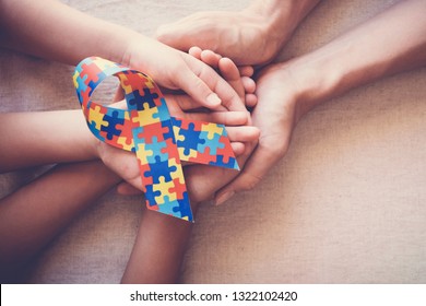 Hands Holding Puzzle Ribbon, Autism Spectrum Disorder , World Autism Awareness Day