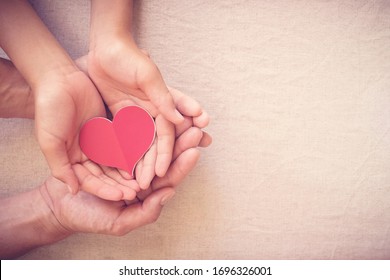 Hands Holding Red Heart, Heart Health, Donation, Happy Volunteer Charity, CSR Social Responsibility,world Heart Day, World Health Day,world Mental Health Day,foster Home, Wellbeing, Hope Concept