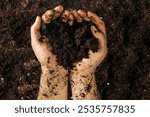 Hands Holding Rich Soil – A Symbol of Growth and Environmental Care, Perfect for Gardening and Agriculture Concepts, High-Quality Stock Photo with Space for Text