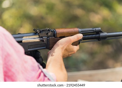 Hands Holding Rifle. Target Practice. Gun Training At Firing Range. Close-up Outdoor Horizontal Shot. High Quality Photo