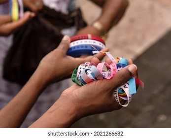 Hands holding a roll of Senhor do Bonfim ribbons. Always on the last Friday of the year, masses are held at Igreja do Senhor do Bonfim in Salvador, Bahia, Brazil.