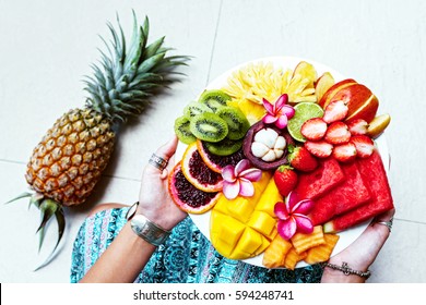 Hands Holding Served Fruit Plate, Top View From Above. Exotic Summer Diet. Tropical Beach Lifestyle.