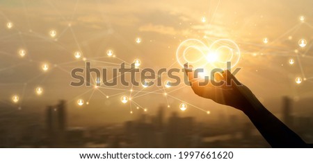 Hands holding sign of infinity on global customer network connection. Digital marketing and unlimited market on  networking. 