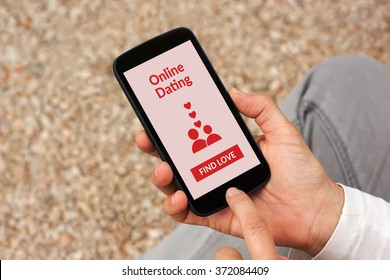 Hands holding smartphone with online dating app mock up on screen. All screen content is designed by me - Shutterstock ID 372084409