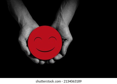 Hands Holding Smile, Great Feedback Rating, Positive Customer Review, Good Experience, Satisfied Survey, Mental Health Assessment, Child Wellness Concept, Red Face On Black Background Copy Space.