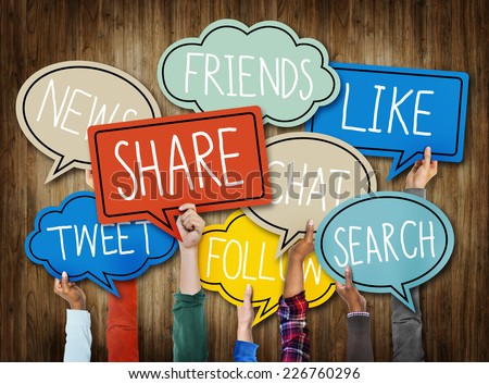 Hands Holding Speech Bubbles with Social Media Words