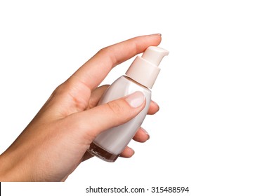 Hands holding and squeezing tube of cream - Shutterstock ID 315488594