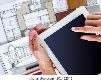 Hands holding tablet with architecture drawing and material sample,  concept of home renovation - Shutterstock ID 201432545