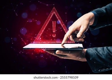 Hands holding a tablet with a glowing triangular warning symbol and exclamation mark, futuristic holographic style, dark virtual background, concept of technology alert