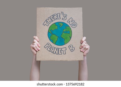 Hands holding "there is no planet b banner" isolated from the background, fridays for future