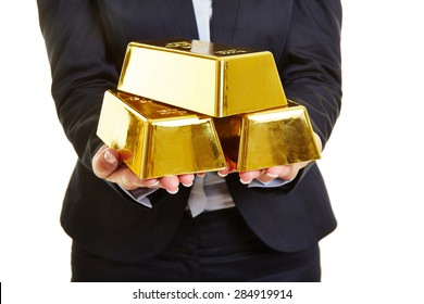Hands Holding Three Gold Bars As Secure Investment
