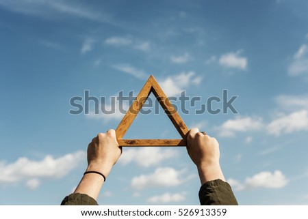 Hands Holding Triangle Symbol Cloudscape Concept