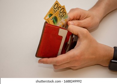 Hands Holding Wallet With Australian Dollars And Counting Money - Coronavirus Finance Struggle Concept