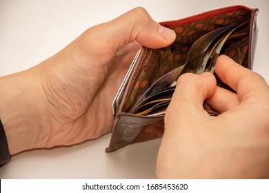 Hands Holding Wallet With Money - Low Income Due To Coronavirus